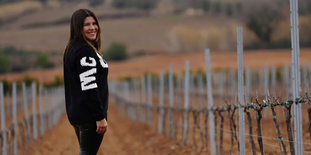 Mary Anna Ossa, owner of Partners and Grapes, proudly awarded the McBride Sisters She Can Fund Scholarship, empowering women in the wine industry through mentorship and financial support.